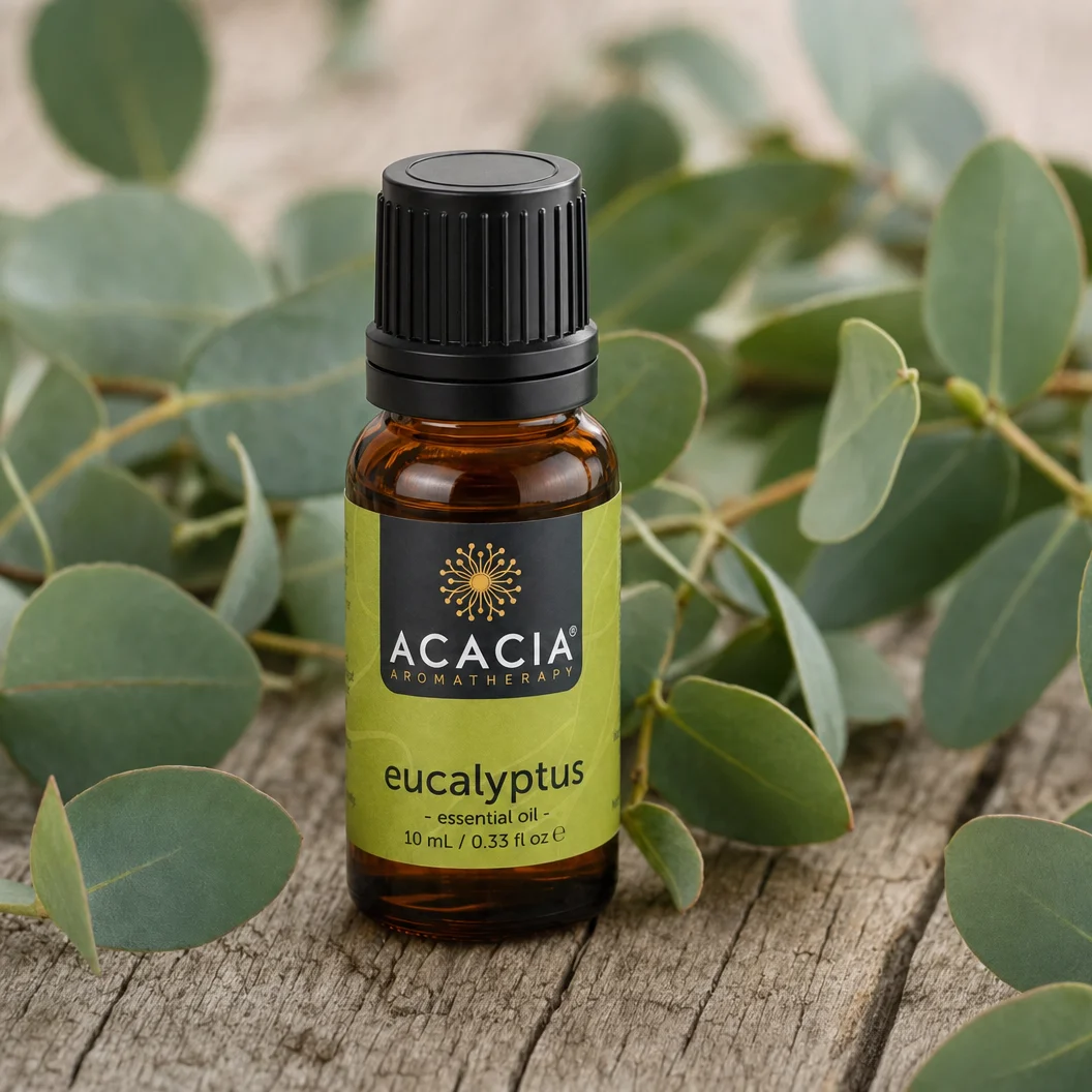 Eucalyptus Pure Essential Oil 10mL lifestyle – Acacia Aromatherapy bottle with eucalyptus leaves on wooden surface, Australia
